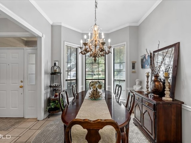 tiled dining room featuring a notable chandelier and ornamental molding