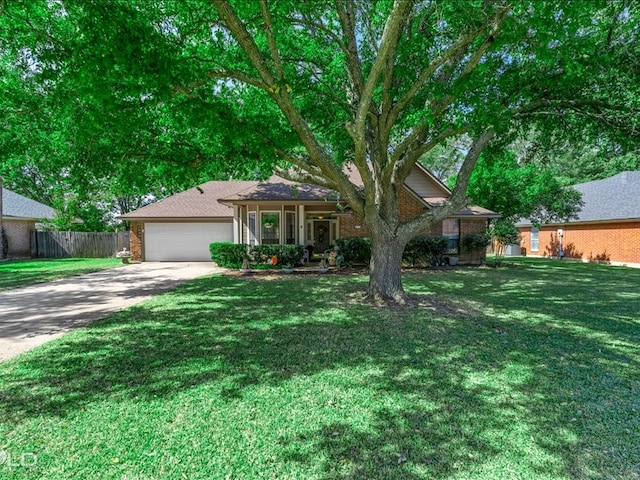 view of front of property featuring a front yard and a garage