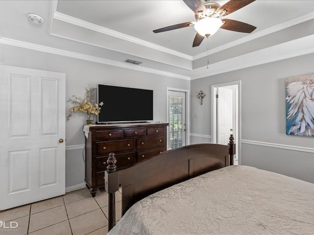 tiled bedroom with ceiling fan and ornamental molding