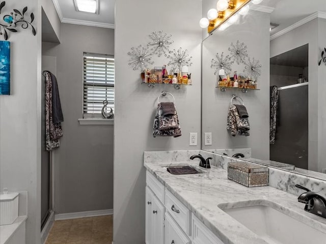 bathroom with vanity, crown molding, a shower with door, and tile patterned floors