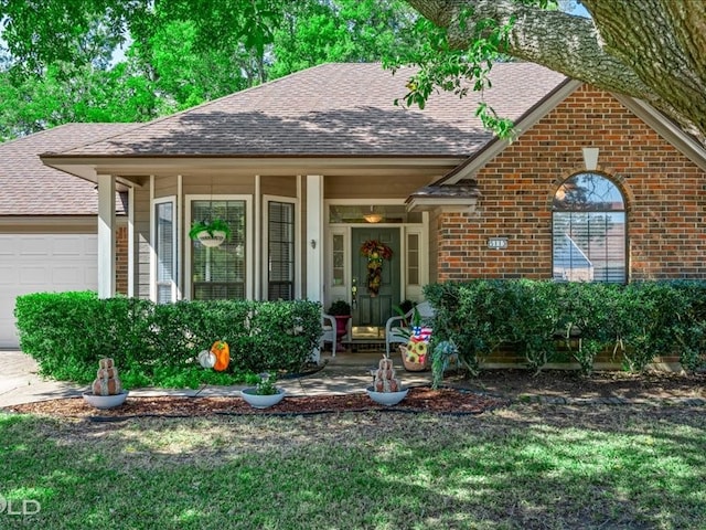 view of front of home with a porch and a garage