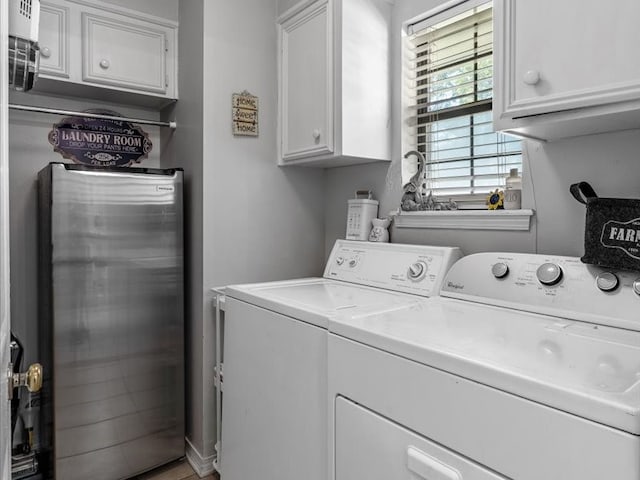 laundry area featuring cabinets and washer and dryer