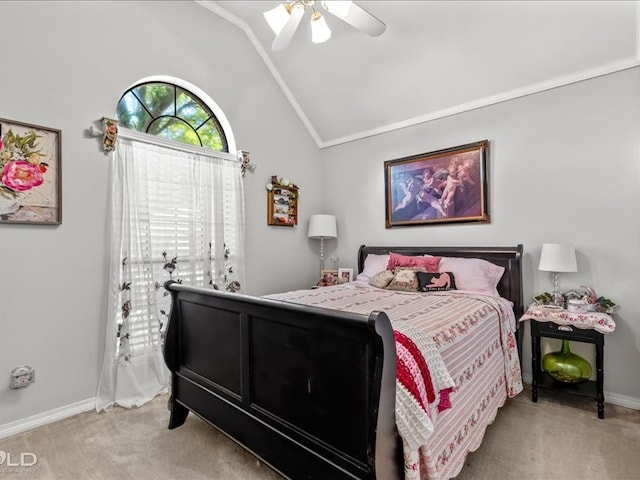 carpeted bedroom with ceiling fan, lofted ceiling, and crown molding