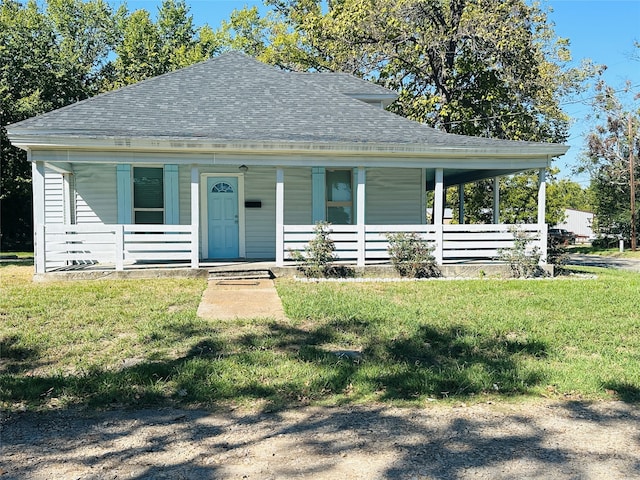 view of front of house with a front yard and a porch