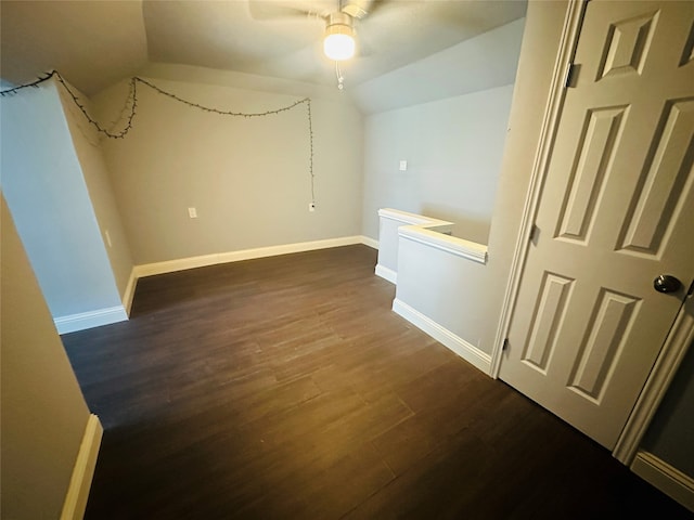 interior space featuring lofted ceiling, ceiling fan, and dark hardwood / wood-style floors