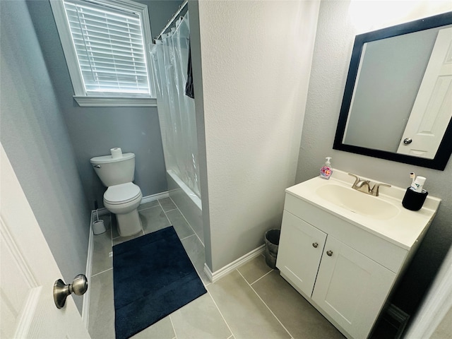 bathroom featuring curtained shower, tile patterned floors, vanity, and toilet