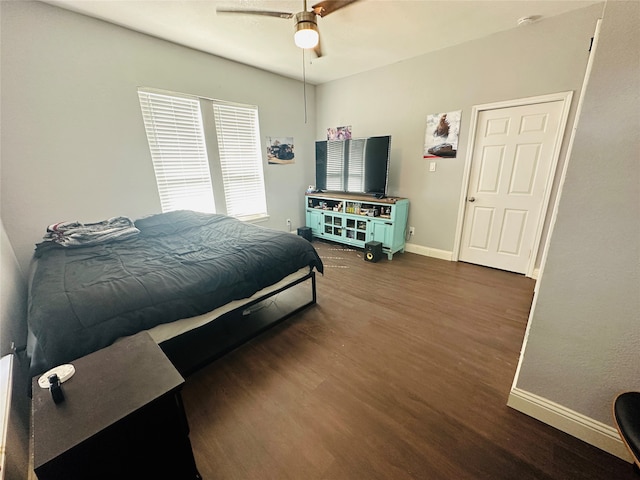 bedroom with ceiling fan and dark hardwood / wood-style flooring