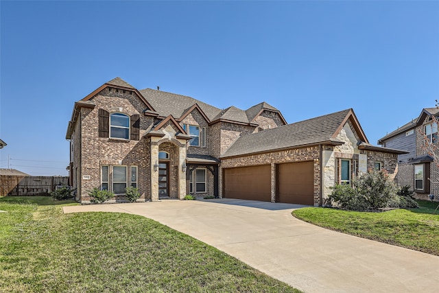 view of front of house featuring a front lawn and a garage