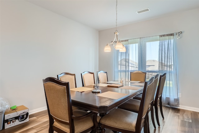 dining room with hardwood / wood-style flooring