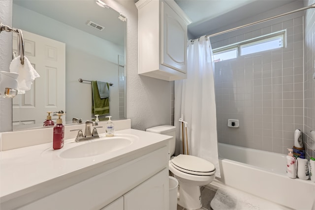 full bathroom featuring vanity, shower / tub combo, and toilet