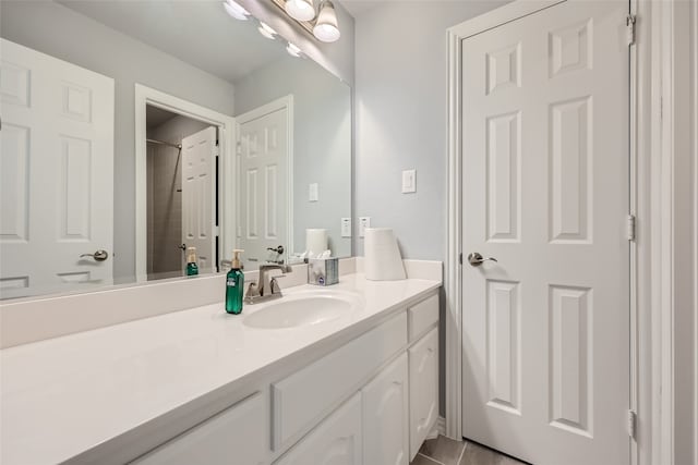 bathroom featuring tile patterned floors and vanity