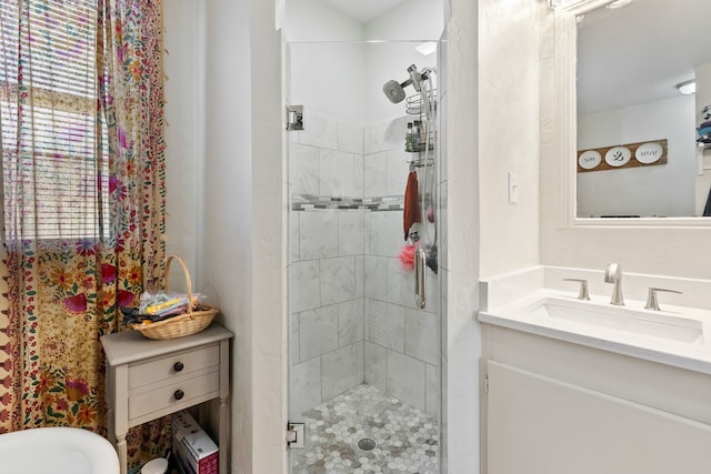 bathroom featuring vanity and walk in shower