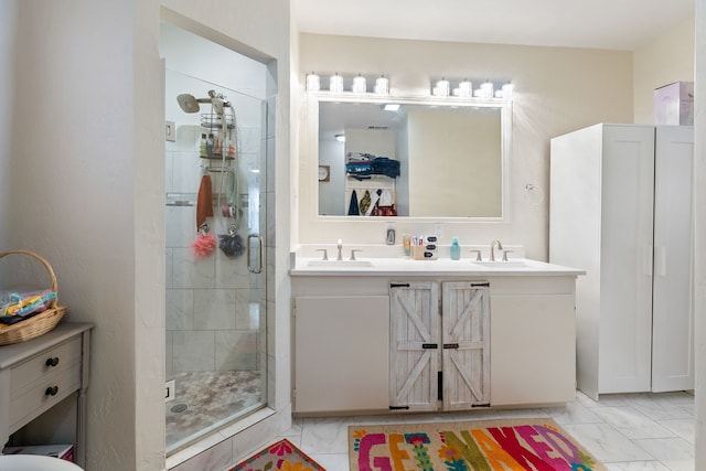 bathroom featuring an enclosed shower and vanity