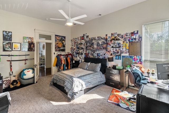 carpeted bedroom featuring ceiling fan