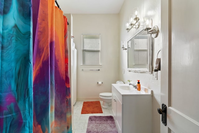 bathroom with tile patterned floors, toilet, and vanity