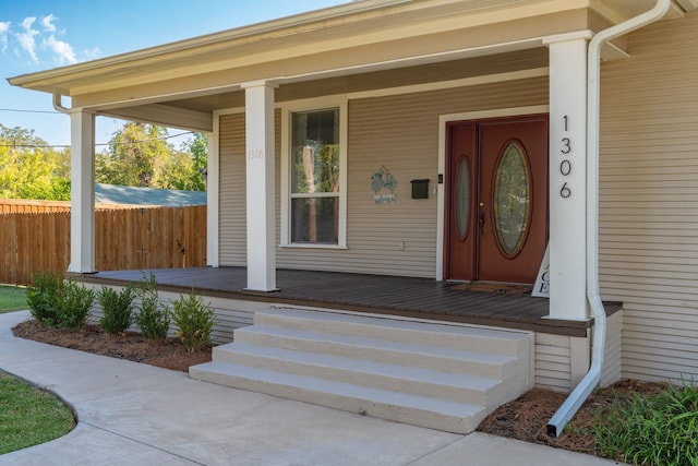 property entrance with covered porch