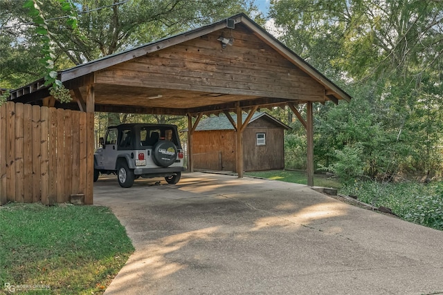 view of vehicle parking with concrete driveway and a detached carport