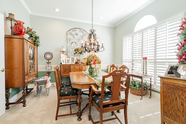 dining area with plenty of natural light, a notable chandelier, and light carpet