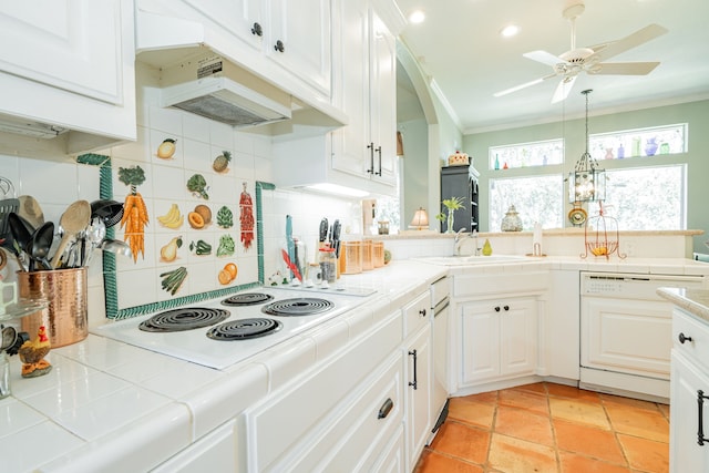 kitchen with white cabinets, backsplash, tile counters, and white appliances