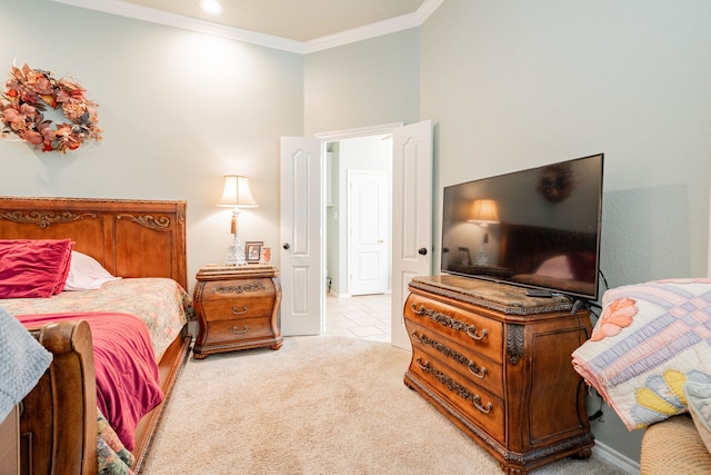 bedroom featuring a towering ceiling, crown molding, and light carpet