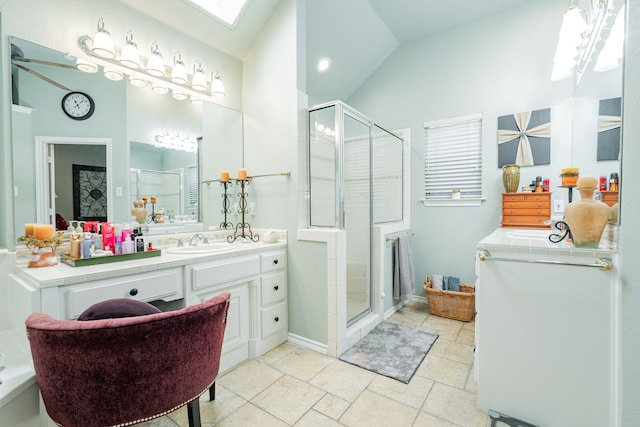 bathroom with vaulted ceiling, a shower with shower door, and vanity