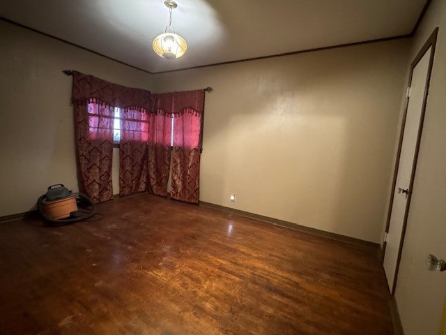 empty room with hardwood / wood-style flooring