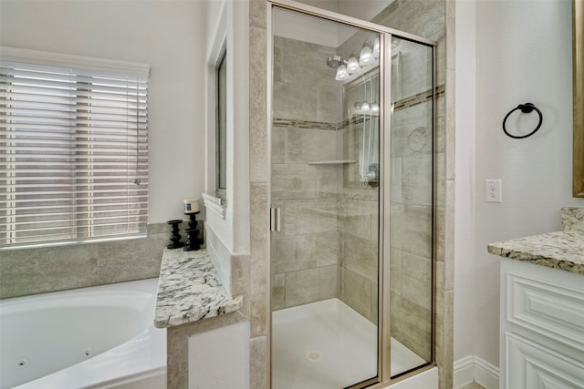 bathroom with vanity and plus walk in shower