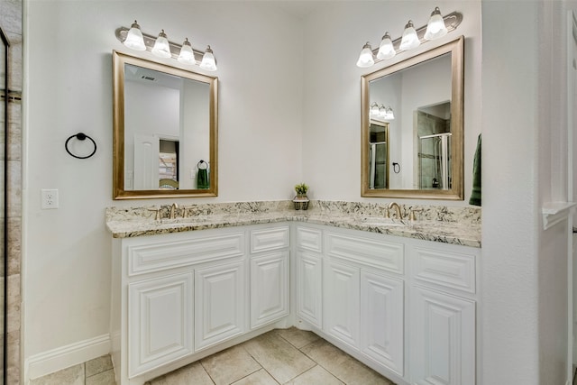 bathroom featuring vanity, tile patterned floors, and walk in shower