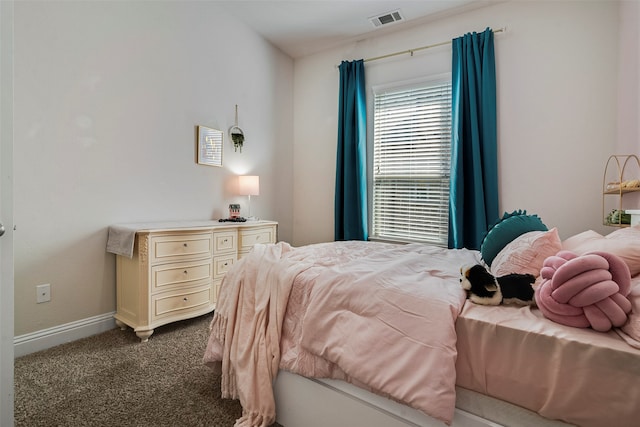 bedroom featuring dark colored carpet