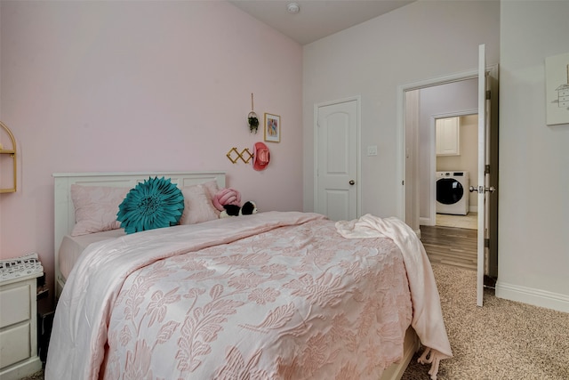 carpeted bedroom featuring washer / clothes dryer