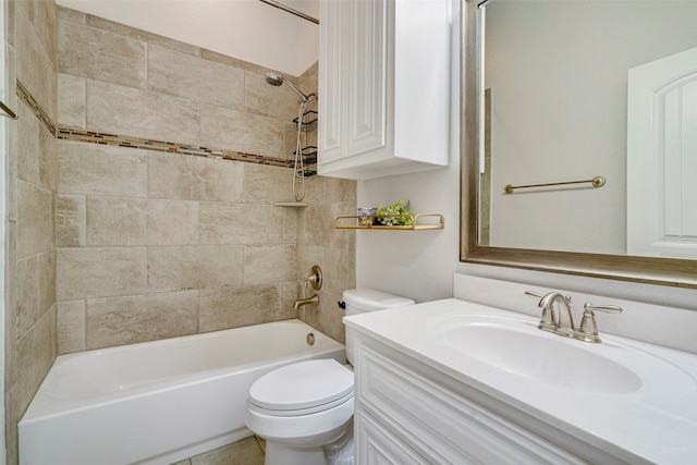 full bathroom featuring vanity, toilet, and tiled shower / bath