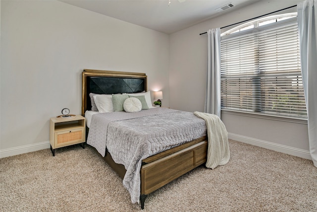 bedroom with light colored carpet