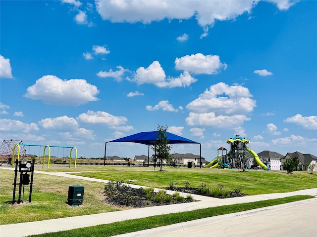 surrounding community with a playground and a yard