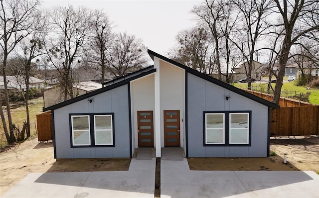 view of front of property featuring fence