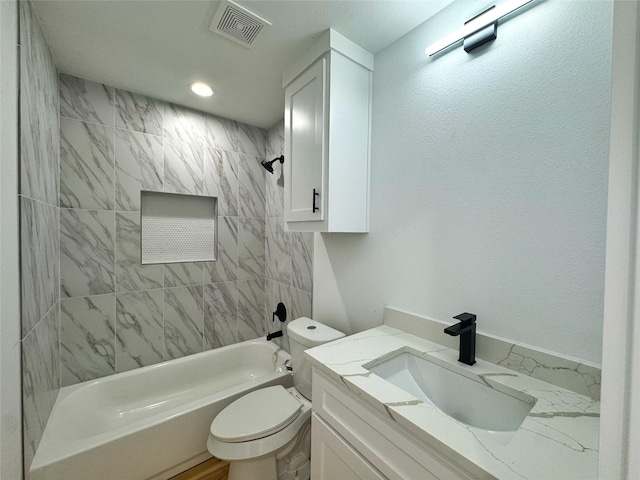 bathroom with toilet, recessed lighting, vanity, visible vents, and shower / bathing tub combination