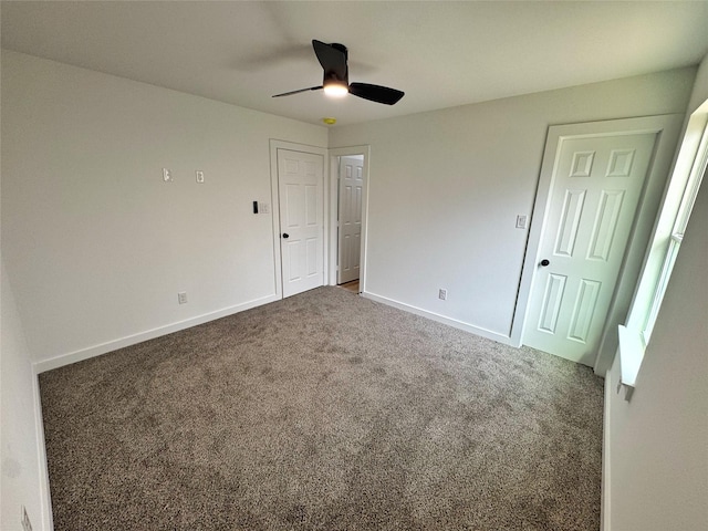 unfurnished bedroom with carpet, ceiling fan, and baseboards