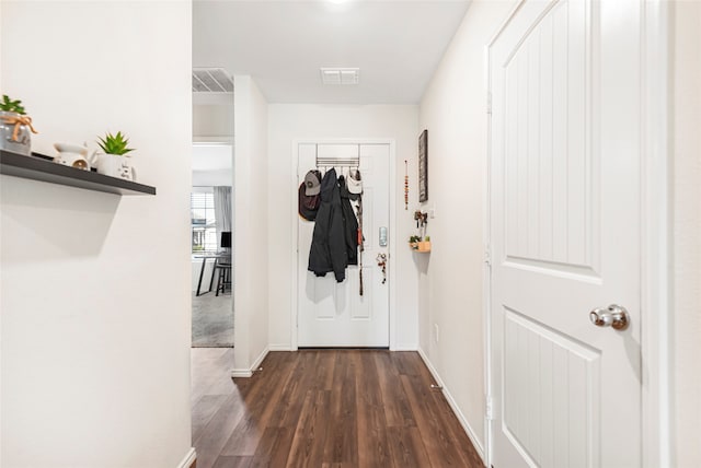 corridor featuring dark hardwood / wood-style floors