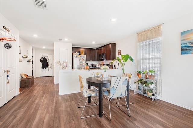 dining room with dark wood-type flooring