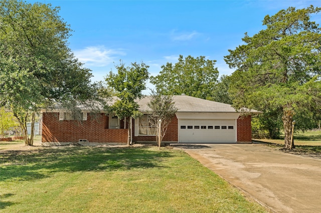 ranch-style house featuring a front yard and a garage