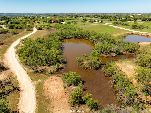 bird's eye view featuring a rural view and a water view