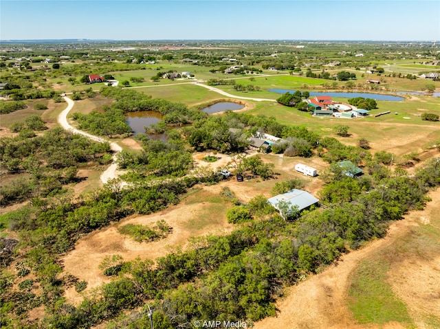 aerial view featuring a water view and a rural view