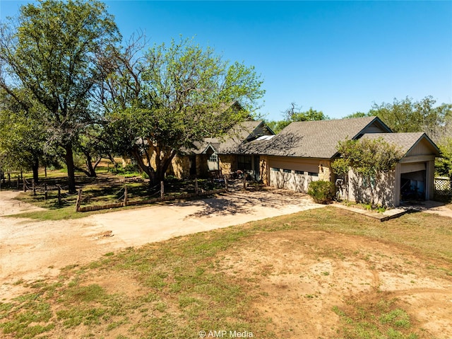 view of front of house featuring a front yard and a garage