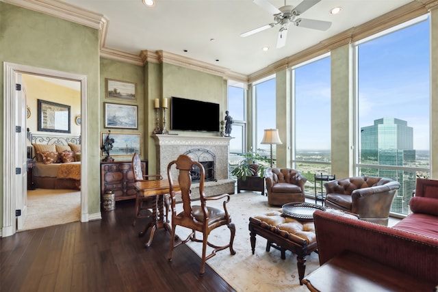 living room with ceiling fan, crown molding, and hardwood / wood-style floors