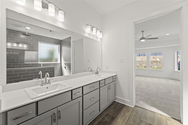 bathroom featuring hardwood / wood-style flooring, vanity, and ceiling fan