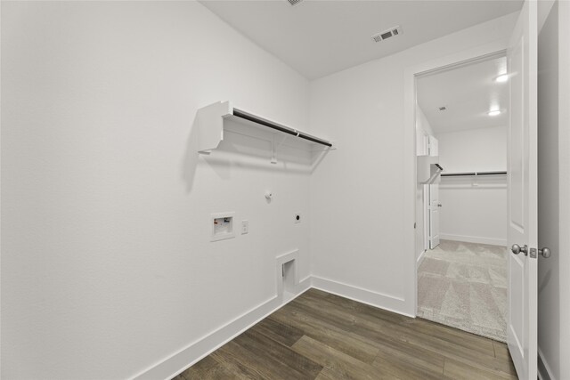 laundry room with washer hookup, hookup for a gas dryer, dark hardwood / wood-style floors, and electric dryer hookup