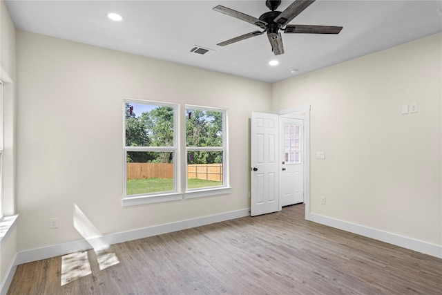 spare room with ceiling fan and light hardwood / wood-style floors