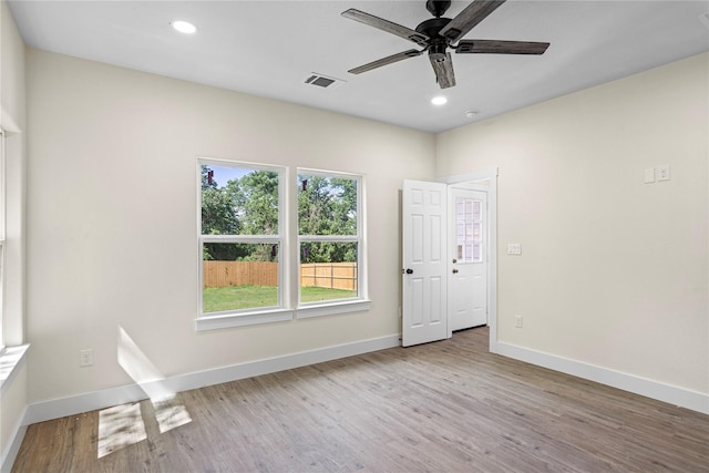 727 W Parnell St, Denison, TX 75020 - unfurnished room featuring ceiling fan, wood finished floors, baseboards, and recessed lighting