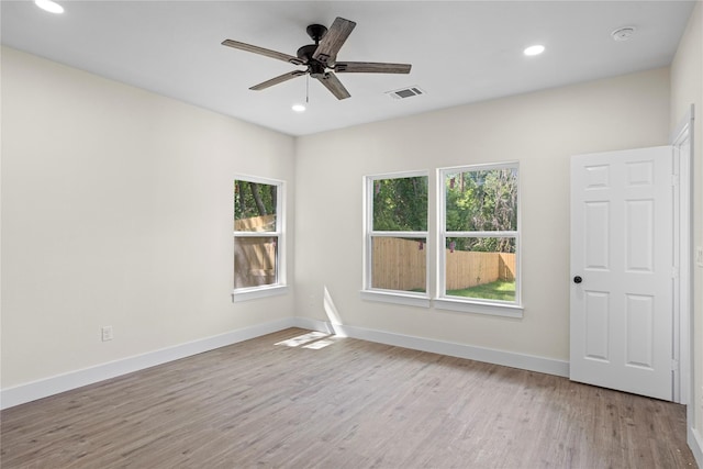 unfurnished room featuring light wood-type flooring and ceiling fan