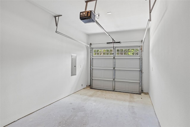 garage featuring a garage door opener and electric panel