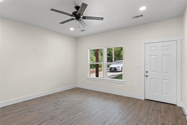 unfurnished room featuring hardwood / wood-style flooring and ceiling fan